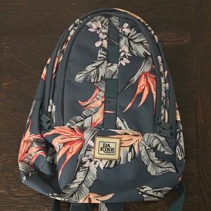 DAKINE Cosmo backpack. Never used. 14.5 x 9”